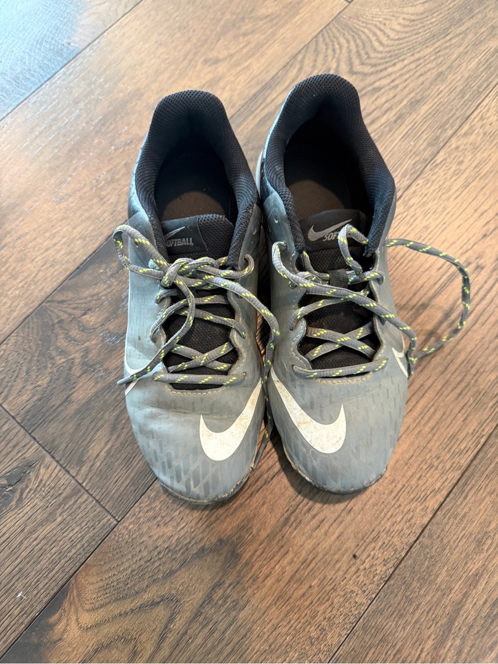 Nike Gray Low-Top Athletic Cleats with White Swoosh